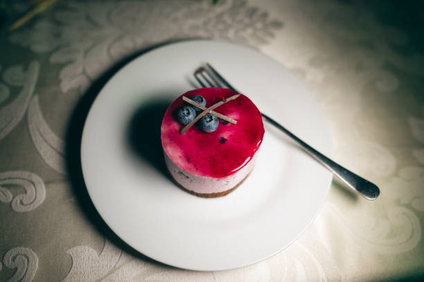 Tasty frozen blueberry cake on the table