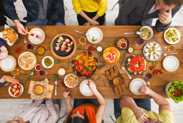 istock People eat healthy meals at served table dinner party 832000624