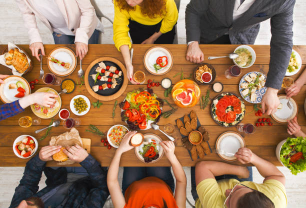 istock People eat healthy meals at served table dinner party 832000826