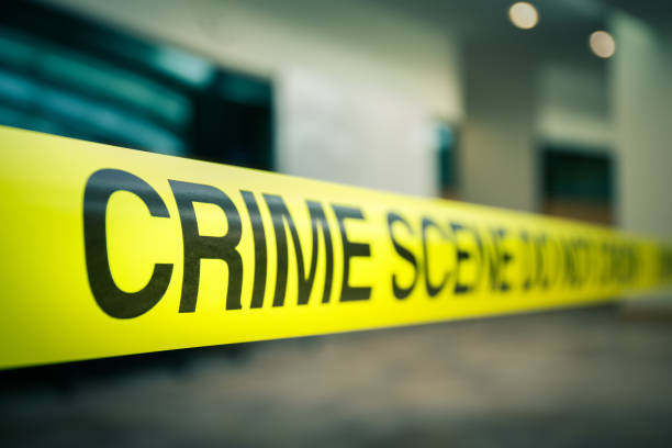 crime scene tape of  mysterious case in cenematic tone with copy space stock photo