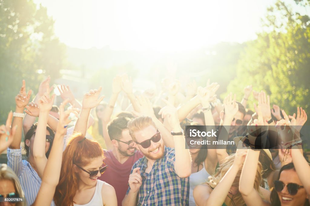 Crowd of people at music festival Crowd of people at music festival dancing and enjoying music Concert Stock Photo