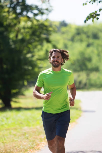 istock Young man running in the park 832018128