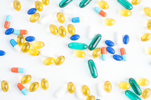 Pill and fish oil capsules background