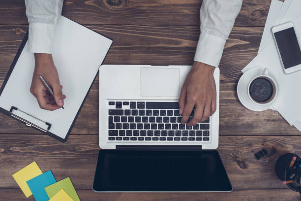 istock Business man working in the office using laptop 832026974