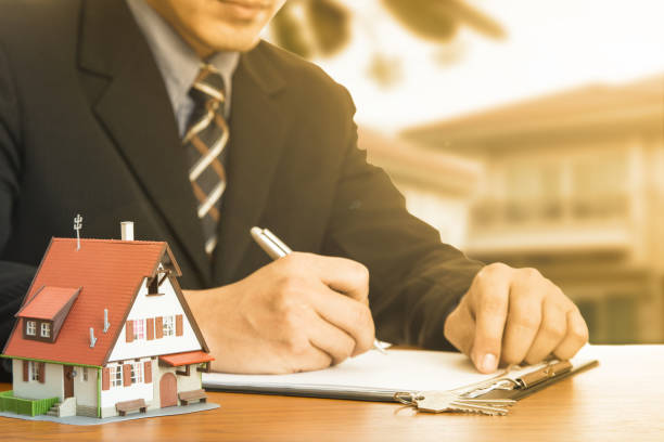 istock Buy house .Businessman calculate 832027140