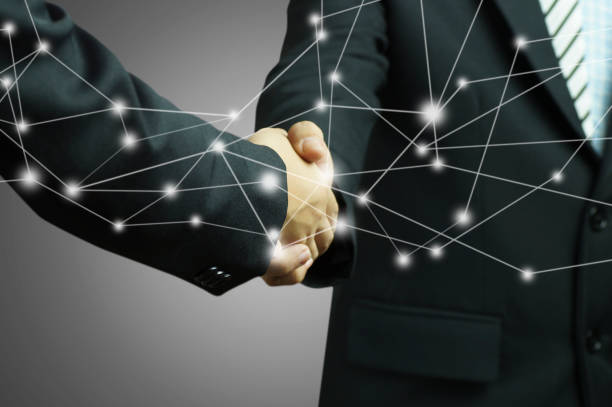 istock businessman shaking hands on gray background and  connection concept 832032588