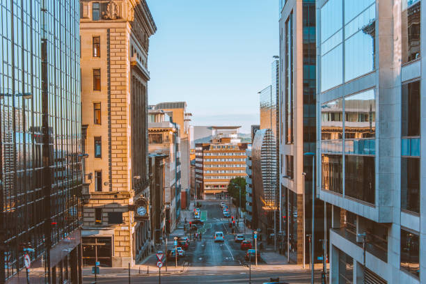 Street in Glasgow A street at sunset in Glasgow, Scotland, at sunset. glasgow scotland stock pictures, royalty-free photos & images