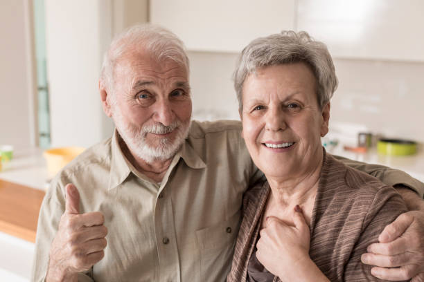 istock Senior couple hugging at home 832037758