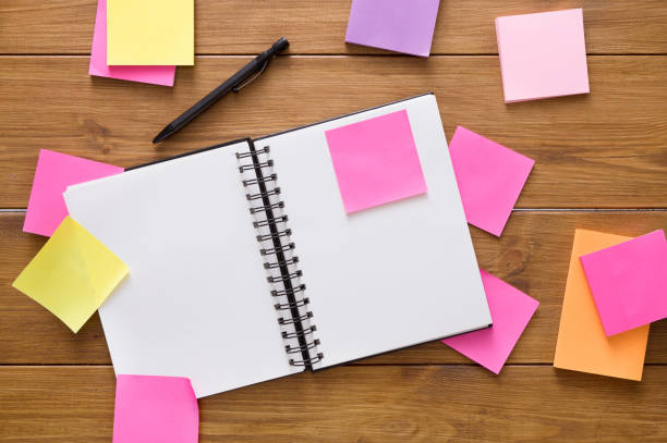 istock Top view of blank notepad on wooden office desk 832039868