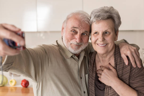 istock Senior couple hugging at home 832040026
