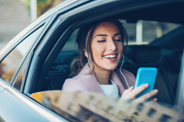 istock Businesswoman texting in the car 832042326