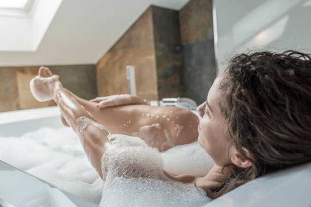 istock Woman relaxing in modern bathtub 832058968