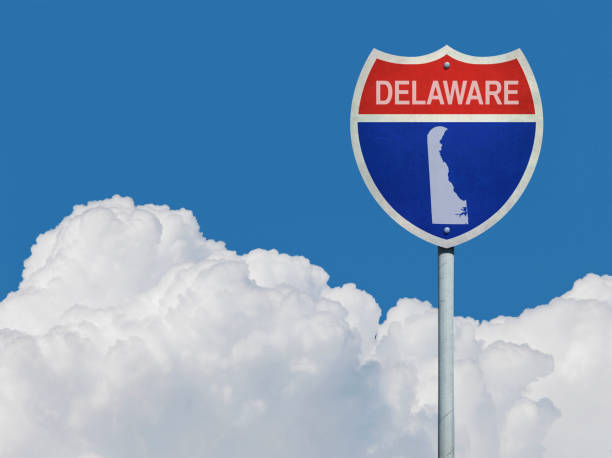 istock Highway sign for Interstate road in Delaware with map in front of clouds 832064520