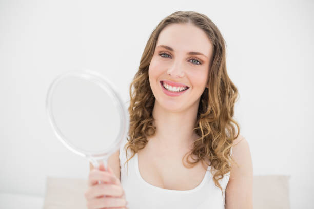 istock Pretty woman holding a mirror 832066052