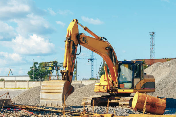 istock Tracked excavator on a construction site amid the pile of rubble 832072488
