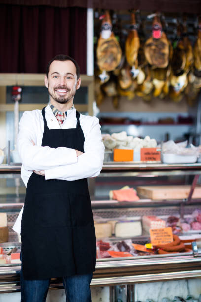 istock Seller offering displayed sorts of meat 832073574