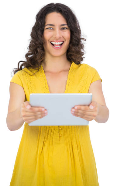 istock Happy casual young woman holding her tablet computer 832074822