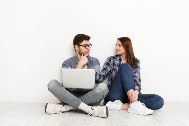 istock Couple discussing work in home interior 832079864