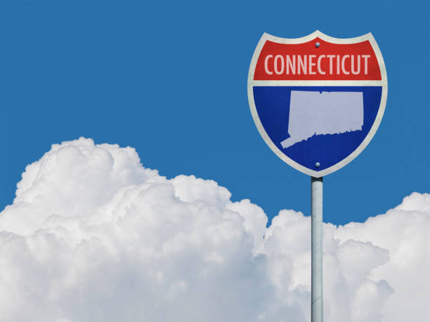 istock Highway sign for Interstate road in Connecticut with map in front of clouds 832080288