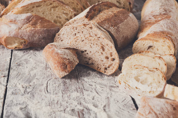 istock Bread background closeup on wooden table 832088306