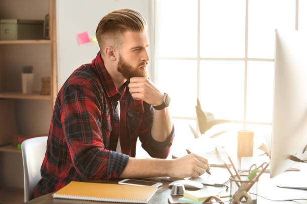 istock Young man architect working in the office ocuupation 832093030