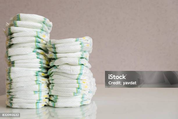 Diapers Isolated Baby Care Studio Shot Stacks Of Diapers For Children Isolated On White Background Stack Of Baby Disposable Diapers Stock Photo - Download Image Now