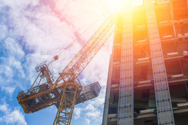 istock Future of Property asset development industry concept. Crain with under construction building. 832100038