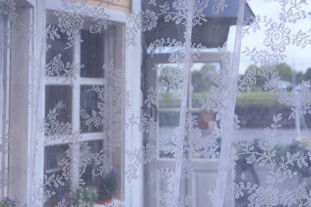 istock Tulle on the window of a summer house 832101998