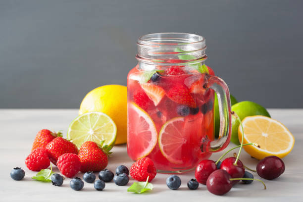 istock summer berry lemonade with lime and mint in mason jar 832105030