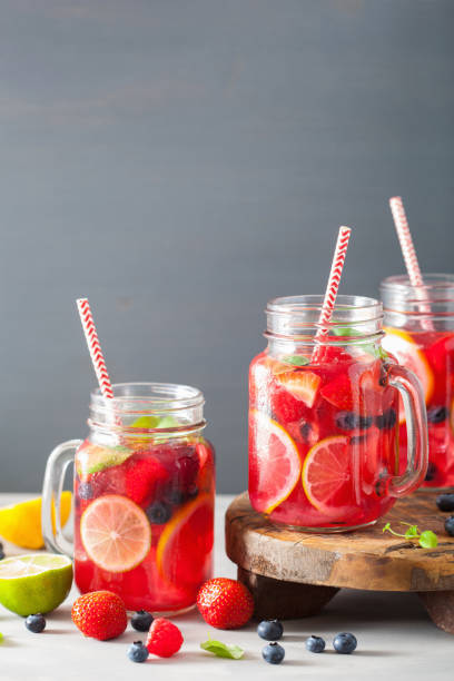 istock summer berry lemonade with lime and mint in mason jar 832105586