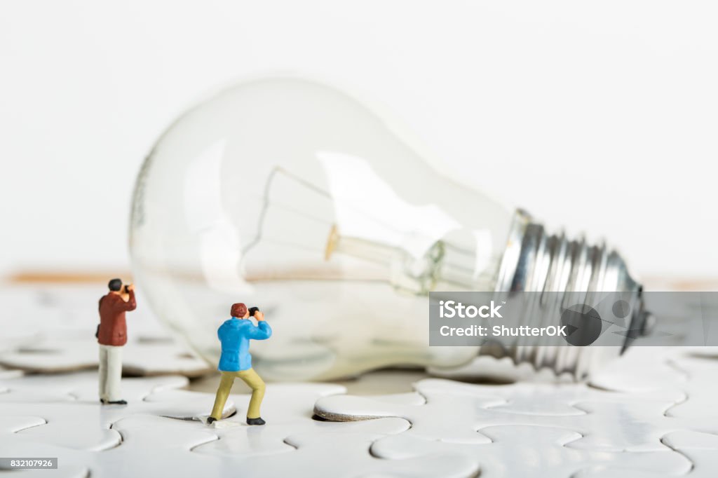 Photographer find creative idea Photographer find creative idea for learning knowledge Figurine Stock Photo