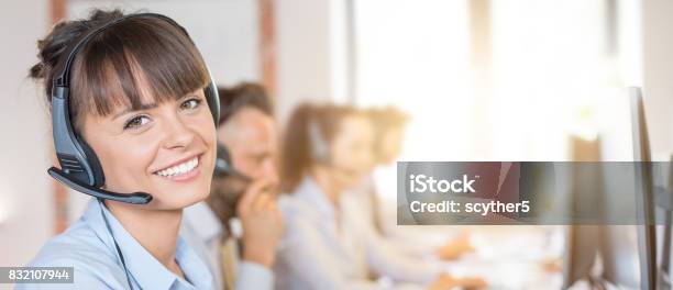 Call Center Worker Accompanied By Her Team Stock Photo - Download Image Now - Call Center, Service, Customer Service Representative
