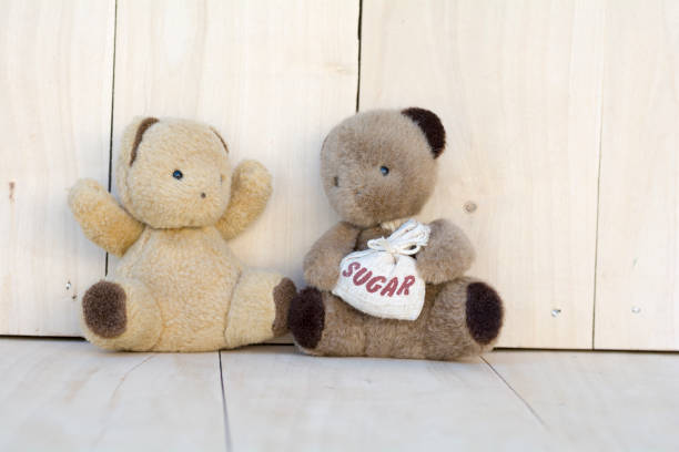 istock Couple Teddy Bears  on wooden  floor. 832109428