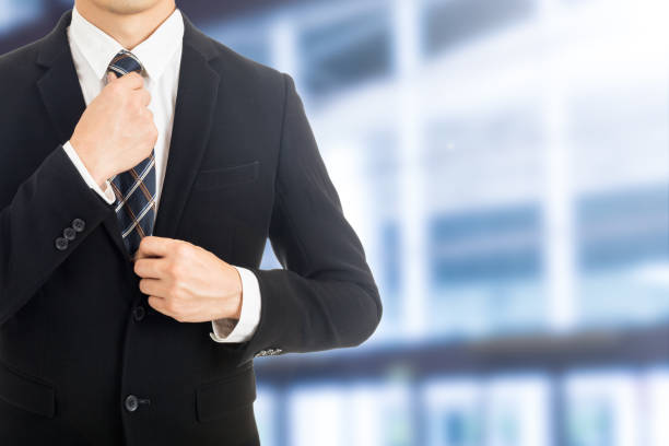 istock Businessman adjust necktie 832112454