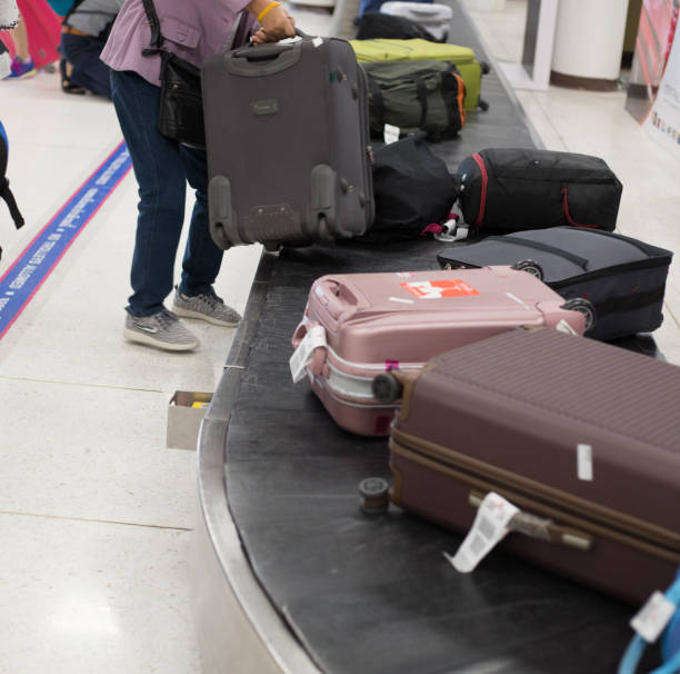 istock Airport terminal passenger get baggage 832112494