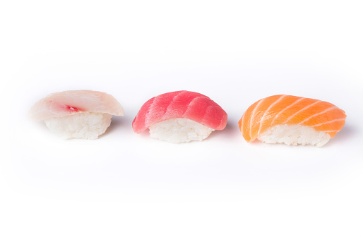 Set of three sushi isolated at white background. Salmon, tuna and seebas nigiri. Asian healthy restaurant food delivery