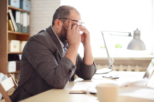 istock Mature Adult man working in the office (problems) 832112830