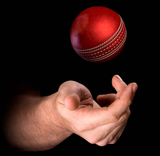istock Hand Tossing Cricket Ball 832115454