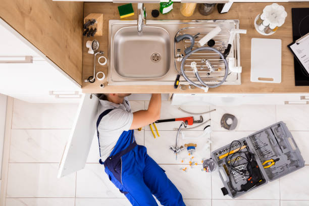 istock Male Plumber In Overall Fixing Sink Pipe 832115608