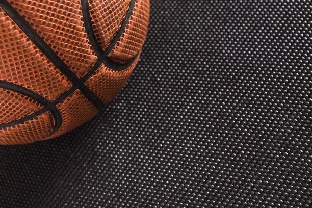 istock Old basketball ball on black background copy space 832116374