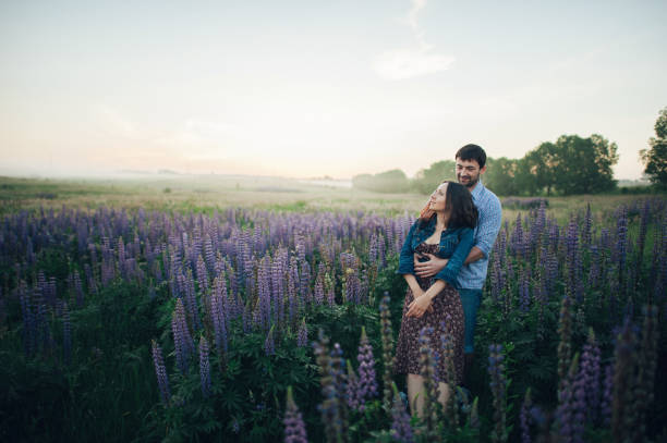 istock Young couple in love walking  in the sunset 832119952