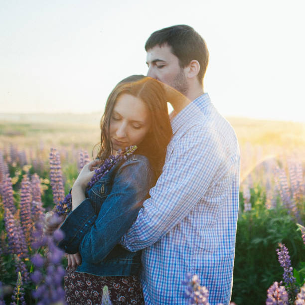 istock Young couple in love walking  in the sunset 832119956