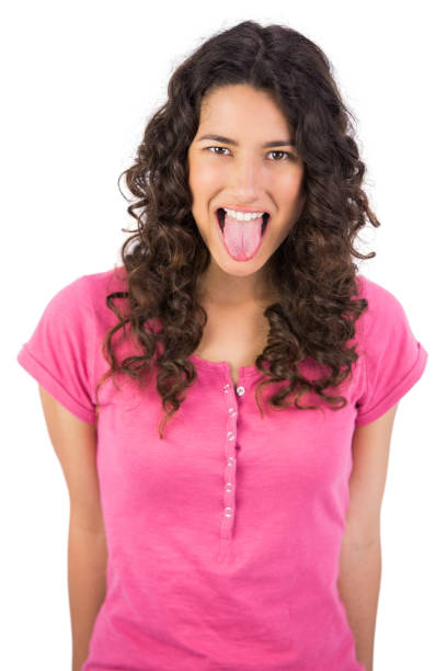 istock Disgusted long haired brunette sticking her tongue out 832120806