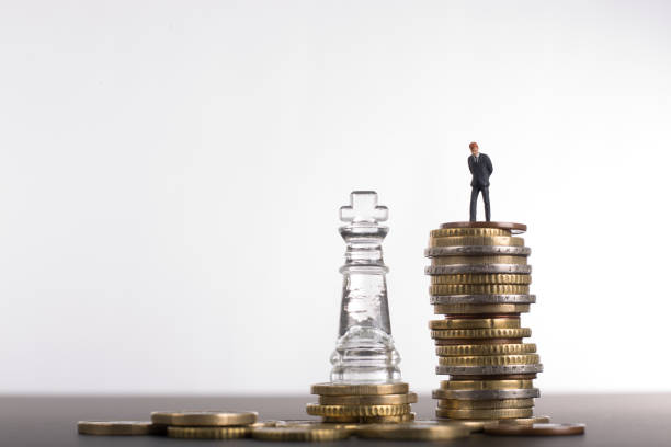 istock Money chess game business 832123654