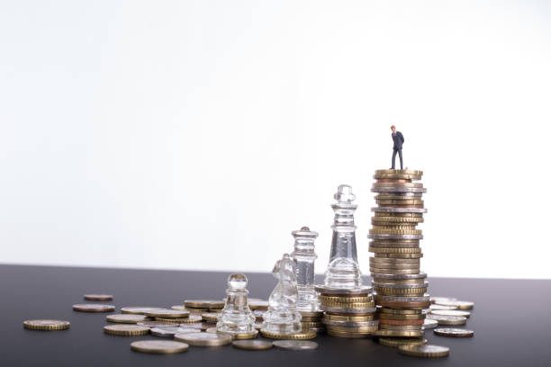 istock Money chess game business 832123722