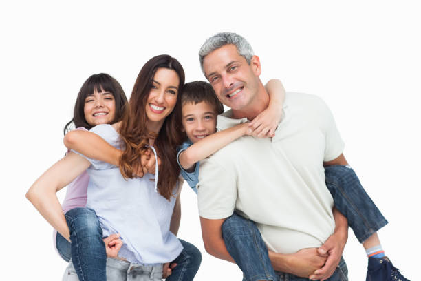 Smiling parents holding their children on backs stock photo