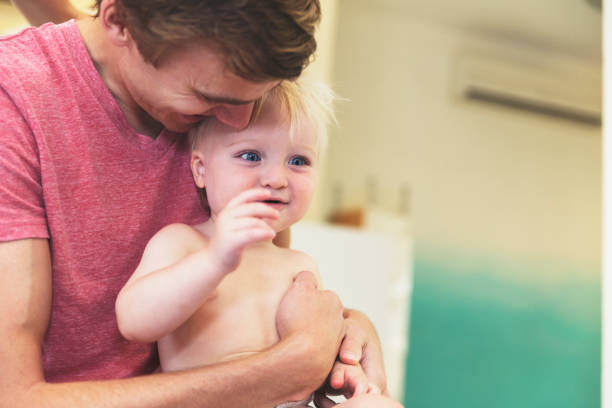 istock Father showering his child with love 832125886