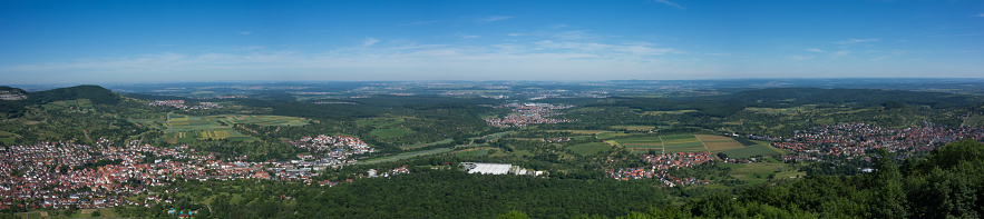This is the view from the viewpoint of Burg Hohenneuffen on a summer day with blue sky