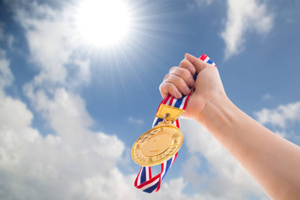 istock The winner holding golden medal 832129192