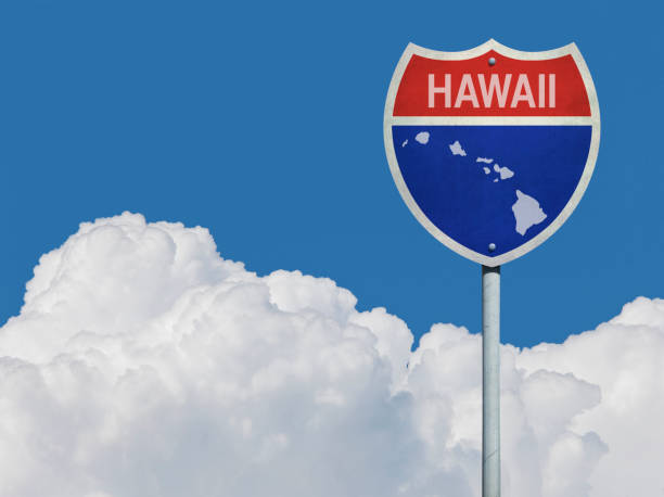 istock Highway sign for Interstate road in Hawaii with map in front of clouds 832133508